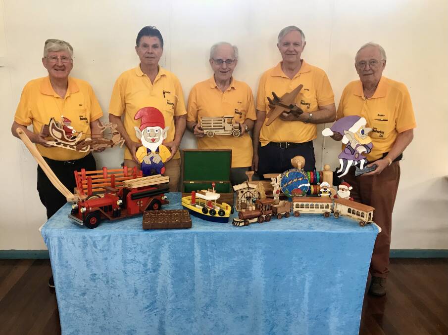 Table of toys: Some of the members of Shire Woodworking Club with their crafty creations, which are donated to children in need.