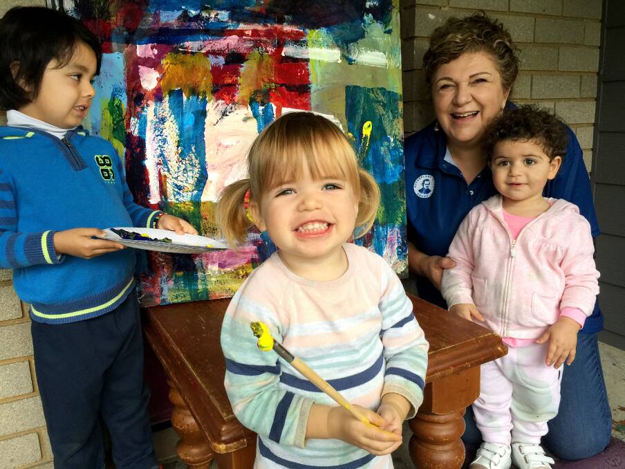 Little painters: Artist Fran Caruana and kids from Bradman Road Menai Early Education Centre collaborate on a creative project. 