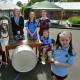 Ringing in the 90th year: Engadine Public School pupils Oliver, Felicity, Charlie, Ruby, Leo and Addison with principal Sara Swift, with an original school timber desk, bell and musical instruments from the early day of learning. Picture: John Veage