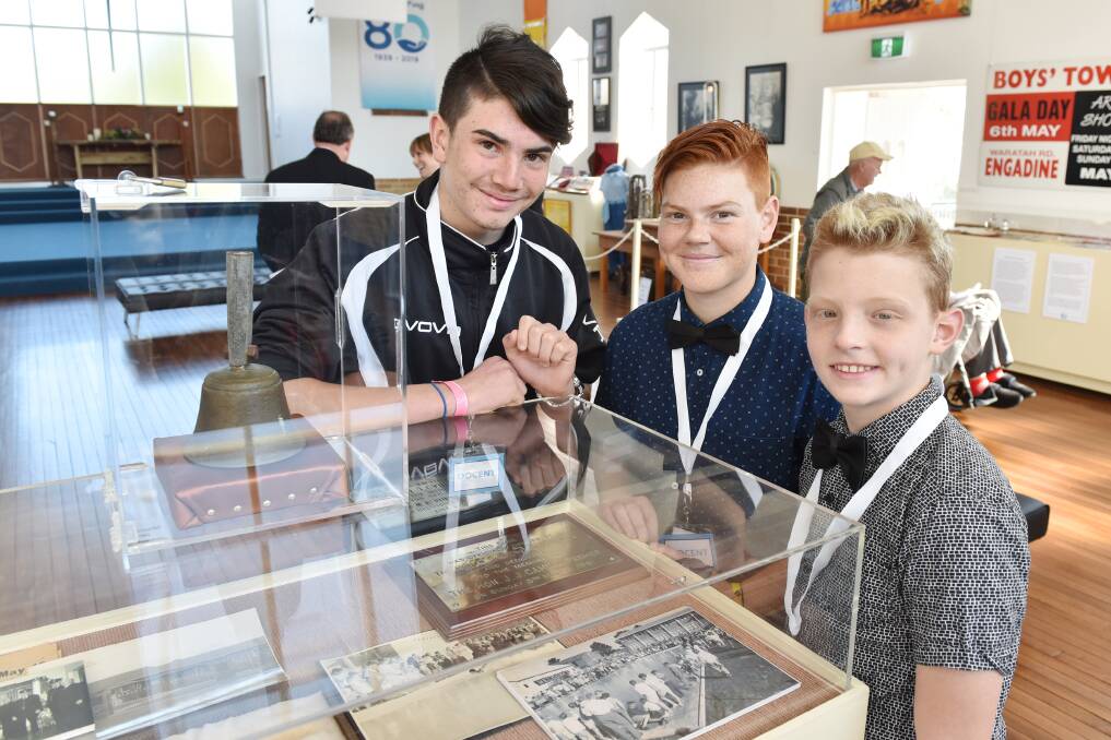 History encased: The younger generation explore the centre's early days with a display of memorabilia at Dunlea Centre's open day for its 80th birthday. 