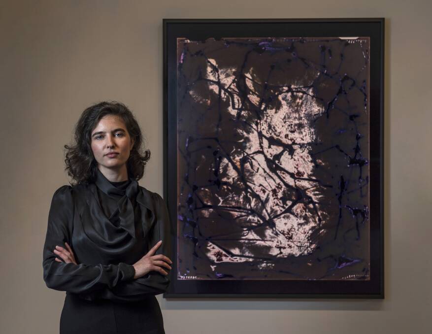 Light and shade: Allawah artist Justine Varga withher award-winning creation, Photogenic 2018. Picture: Peter Morgan