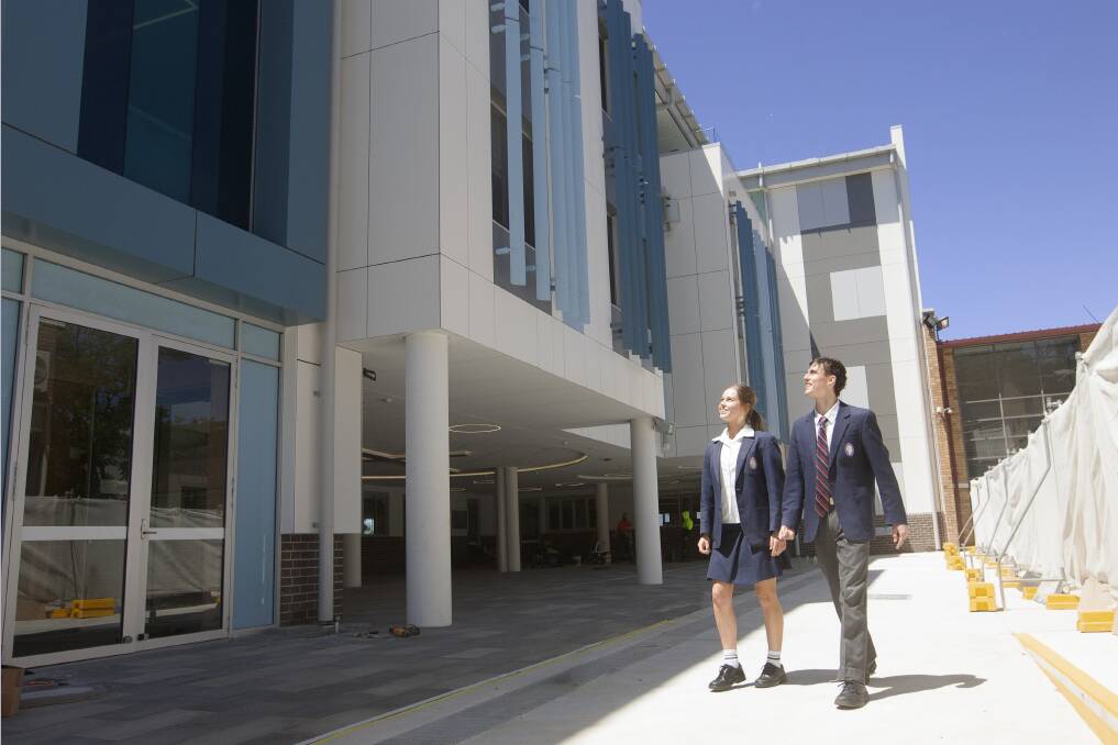 Tall order: Students Sophie Hart and Ryan Andrews explore their new learning space.