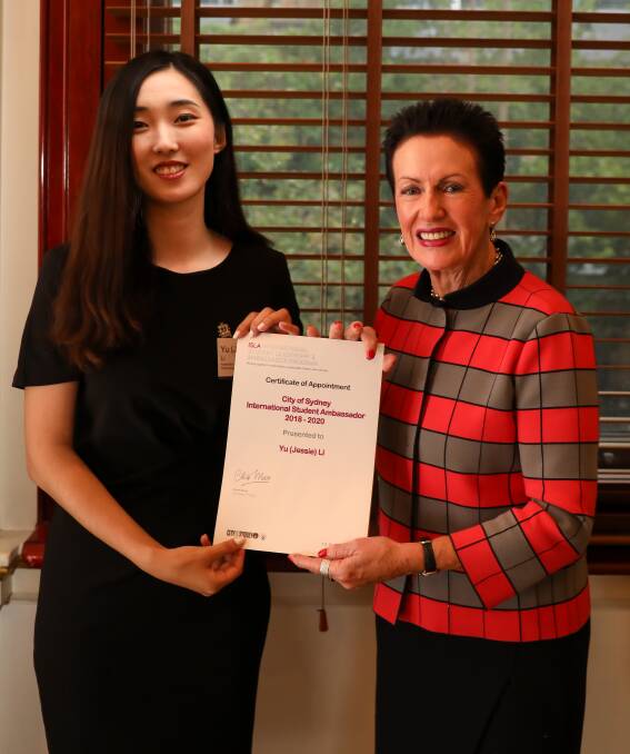 Inspiring: Jessie (Yu) Li receives her certificate from Sydney mayor Clover Moore.