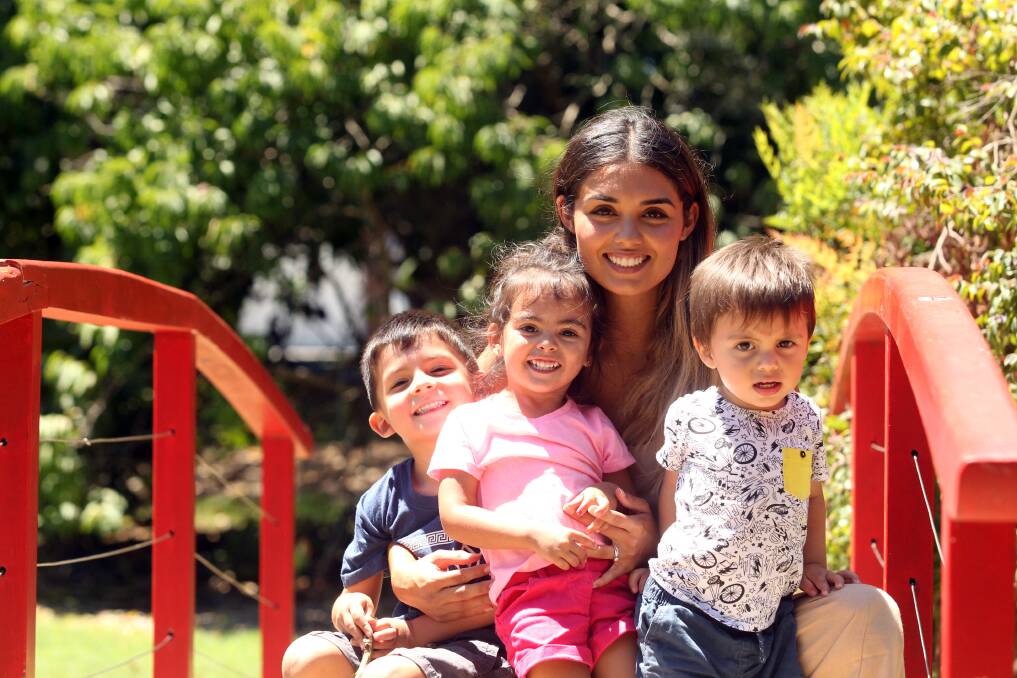 Family first: Yasna Alaina, pictured with her three children Zavier, Adelina and Gabriel, is concerned about making ends meet each pay cheque, when also having to fork out on childcare costs. Picture: Chris Lane