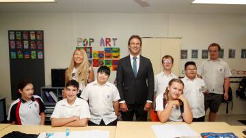 Port Hacking High School Head of Special Education Abigail Gassman and Principal Rick Turansky with students. The school has an extra class in 2024 because of growing demand. Picture by Chris Lane