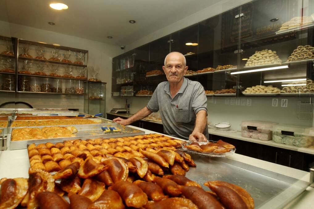 The owner of Said Pastry at Arncliffe, a popular Lebanese sweets shop, is also preparing batches of sweets, which he makes fresh every afternoon. Picture by Chris Lane
