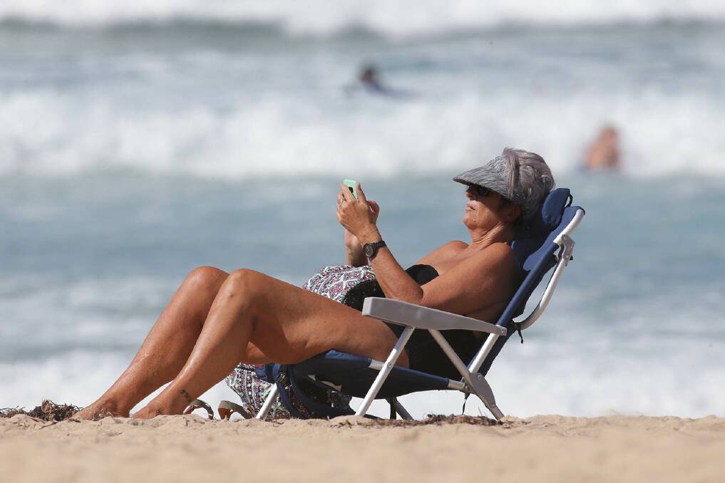 Beach-goers enjoy the sun, sand and surf on a 30-degree-plus day at Wanda. Pictures: John Veage