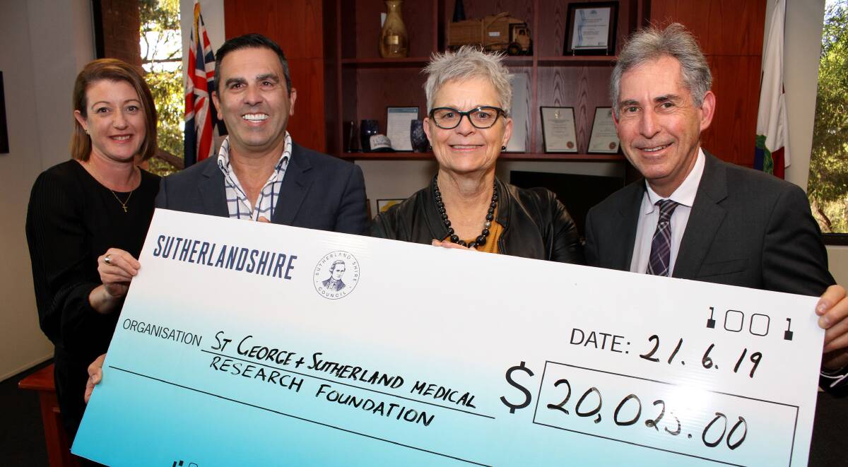 Charity ball gift: Tracie Junghans of St George and Sutherland Medical Research Foundation, Sutherland mayor Carmelo Pesce, foundation chief executive Jacquie Stratford and Sutherland Medical Research Foundation, and Associate Professor Peter Gonski.