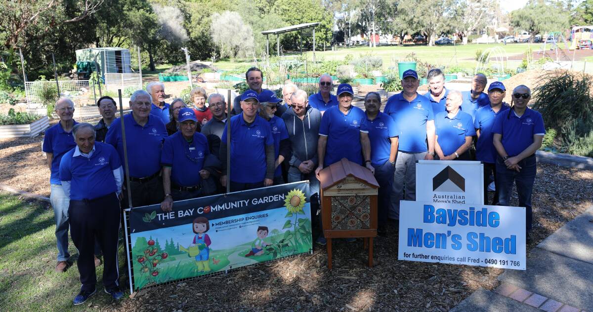 Hive alive: Members of Bayside Men's Shed together with The Bay Community garden and Rockdale MP Steve Kamper.