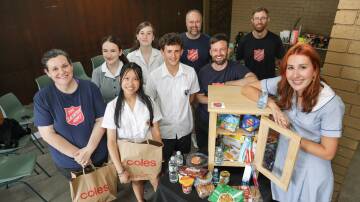 Students from Caringbah and Woolooware high schools made a mini-pantry in their woodwork class that will provide food to people who don't have a safe roof over their heads this Christmas. Picture by John Veage
