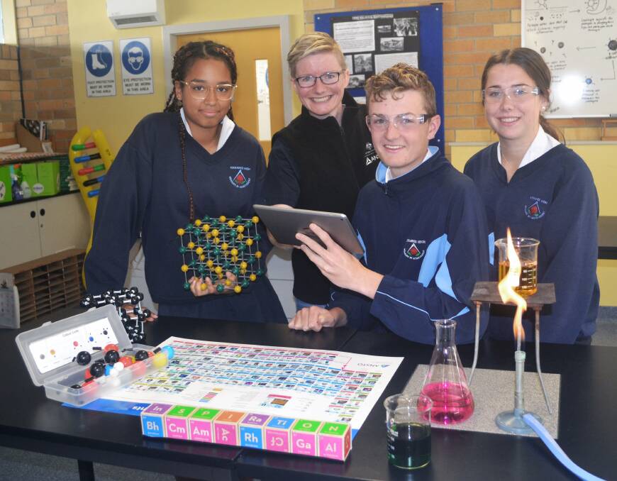 Tap and swipe: Kirrawee High School students try out a free periodic table app launched by ANSTO.