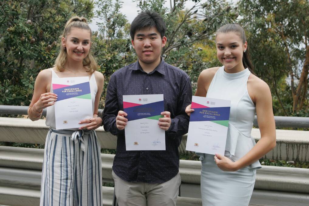 Proud as punch: Ashleigh Wake (St Ursula's Kingsgrove, first in English Standard, Ze Hong (Nathan) Zhou (St Patrick's College, equal first in Mathematics), Lauren Agostini (Aquinas College, equal first in Community and Family Studies)