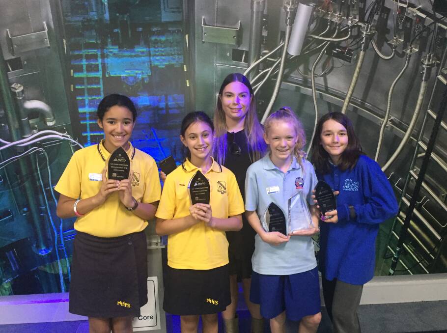 Top coders: Bundeena Public School pupils Zyren Case and Rosa Phelan (pictured far right) with their coding prizes.
