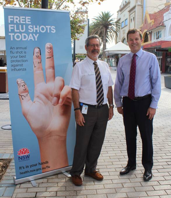 Public health unit director of South Eastern Sydney Local Health District, Professor Mark Ferson, promotes free flu jabs at Cronulla today, with Cronulla MP Mark Speakman.