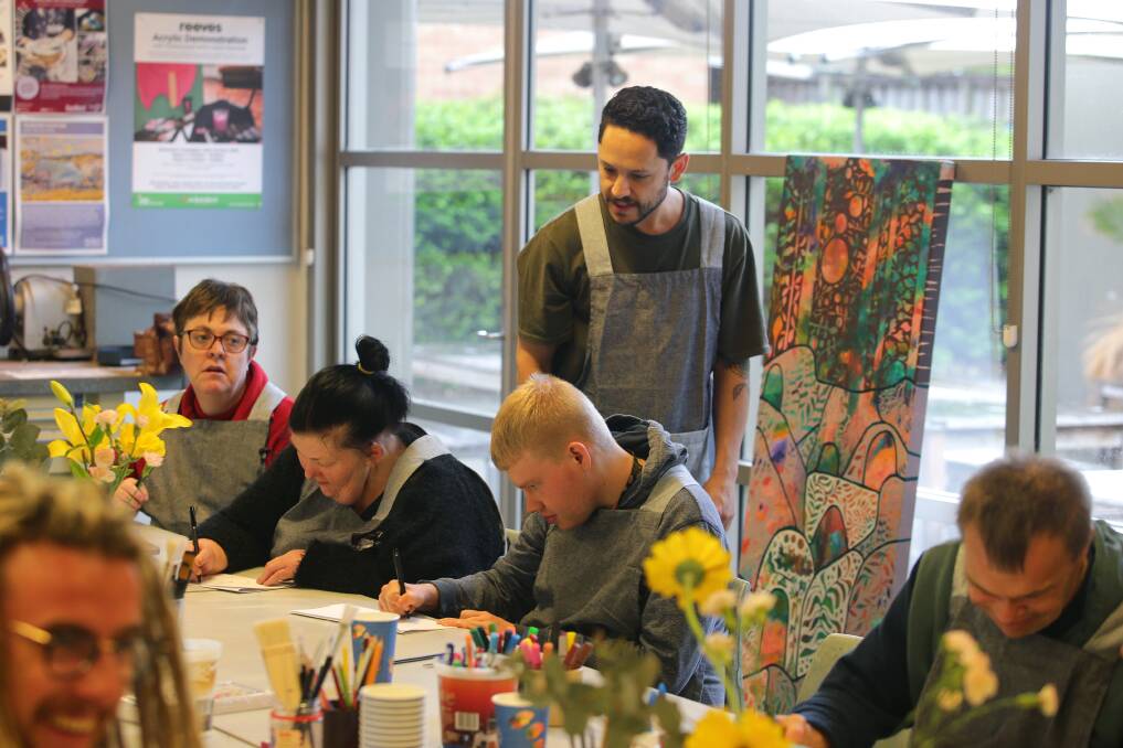 Nature in the works: Civic Disability Services participants collaborate in an art workshop with Australian artist Eduardo Wolfe-Alegria. Picture: John Veage