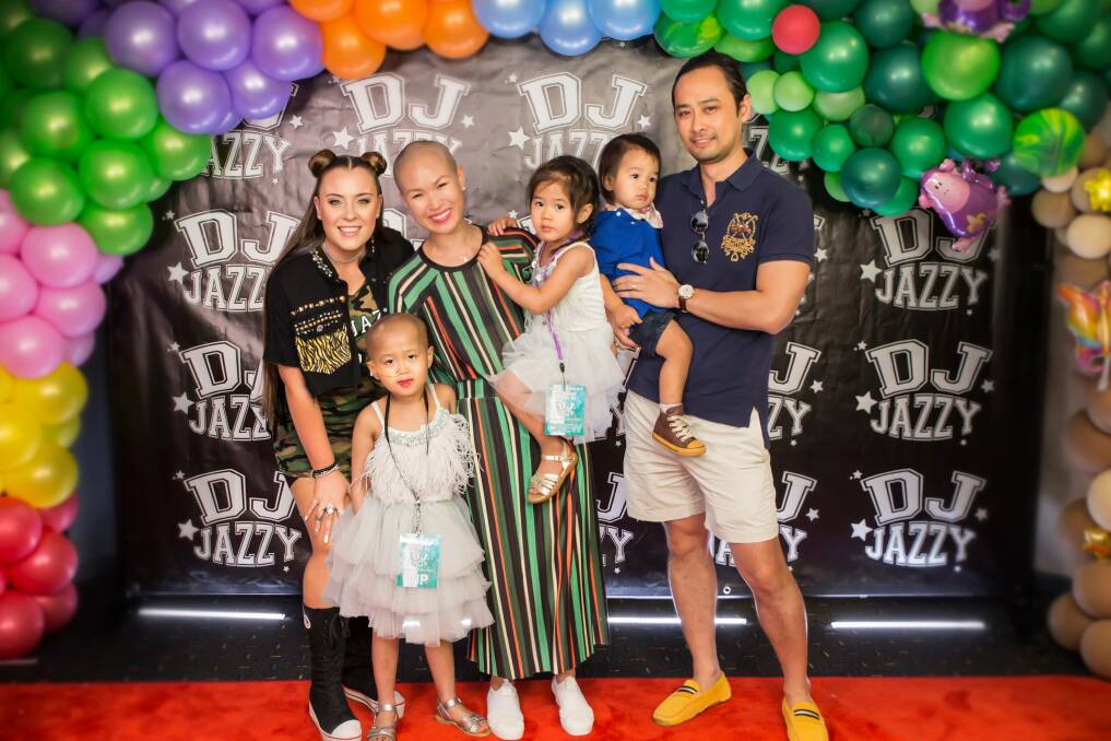 Family fun: Milan with her sister Michah, brother Major, mother Marilee and father Minh.
They are pictured with DJ Jazzy at the event.