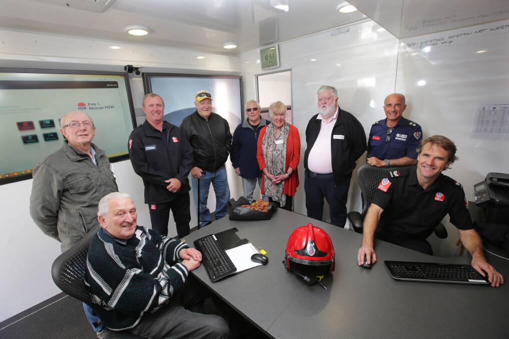 Generational split: Some of the retired crew with current members of Kogarah Fire Station. Picture: John Veage