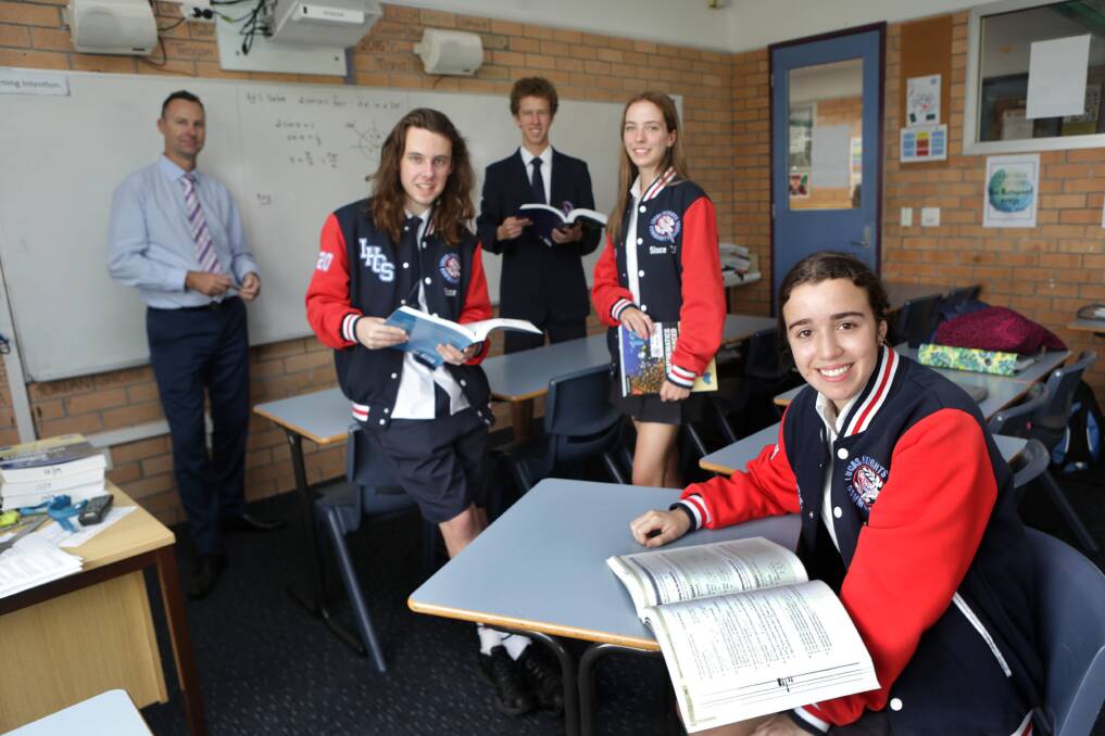 The numbers game: The NSW government wants a "back to basics" approach to prioritise maths from 2020. Head of maths of Lucas Heights Community School, Daniel Conlan, is pictured with students Daniel, Mia, Aidan and Aylaexis. Picture: John Veage