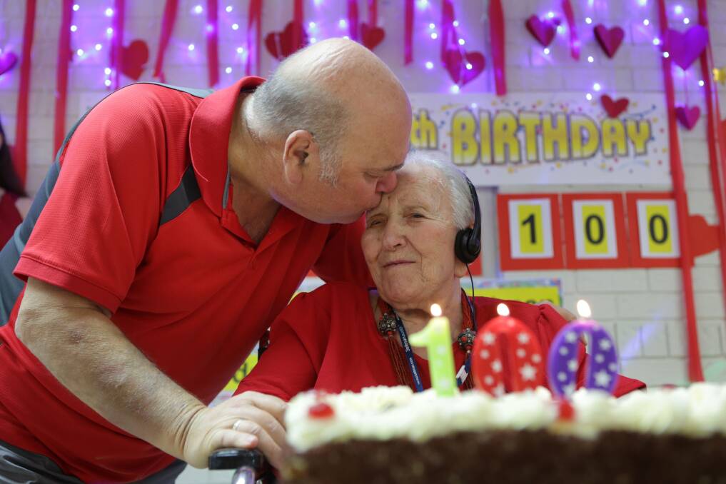 Birthday kiss: Kornelia Shore with her son Brian Shore at her 100th birthday party at Anglicare Mary Andrews Village. Picture: John Veage