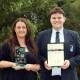 Tharawal Public School teacher Kirsty Adams and The Jannali High School captain Max McKimm with their awards for excellence in Aboriginal education. Picture by Chris Lane