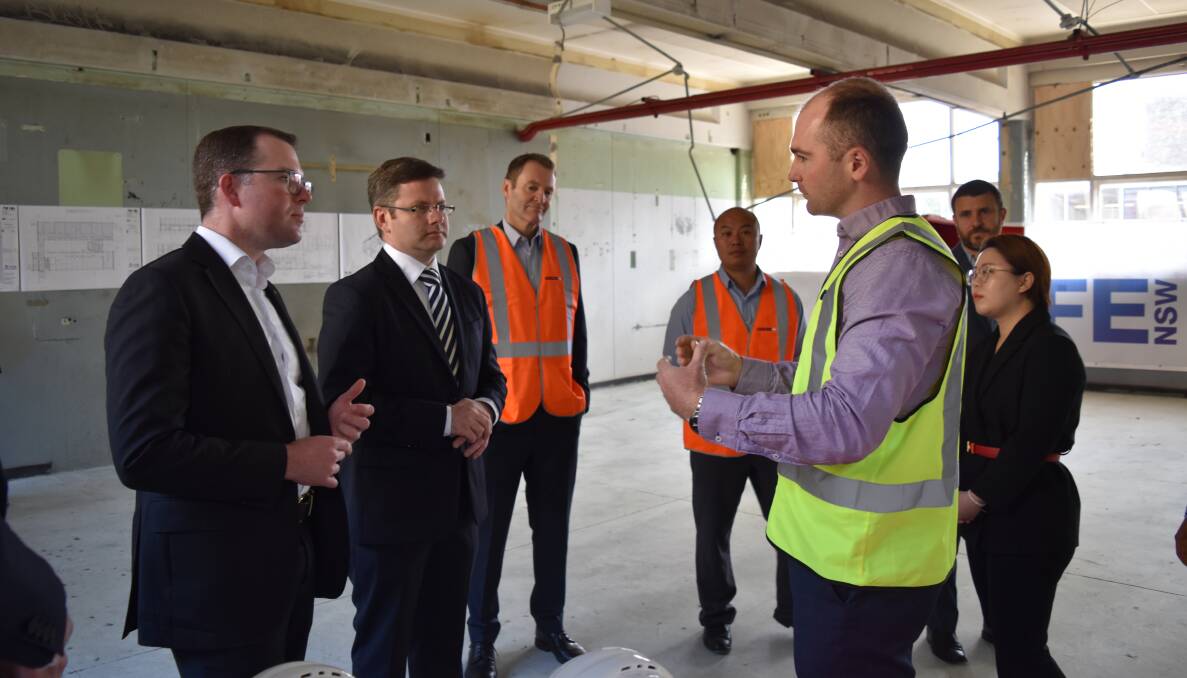 Site tour: Mr Marshall and Mr Coure take a tour of the TAFE campus project.