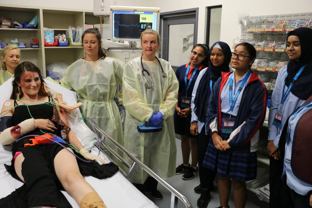Reality unfolds: Students watch a re-enactment of a typical trauma scenario at St George Hospital. 