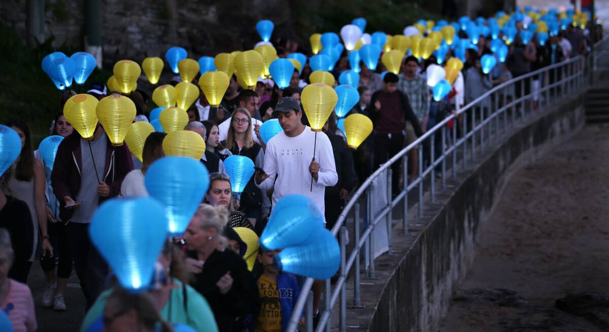 Seaside stroll of solidarity: Hundreds of people walked the Esplanade at Cronulla with lanterns in support of The Leukaemia Foundation. Picture: John Veage