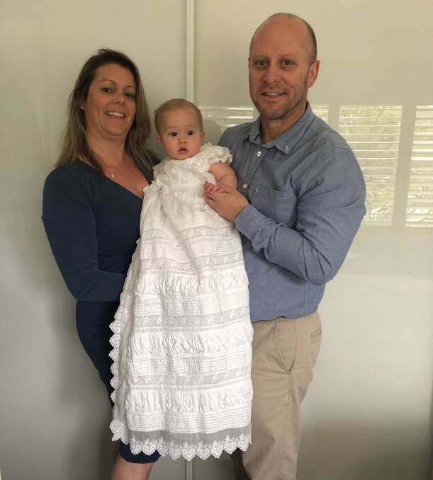 Making history: Tracy Bell and her fiance Stephen Nott with Mitchell, who will be the last one in his family to wear the gown that was made in 1882.