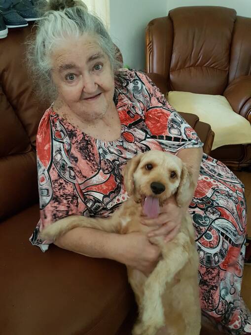 Friends: Rhonda and her pet dog and loving companion, Benji. Rhonda is visited regularly by a volunteer who helps look after Benji.