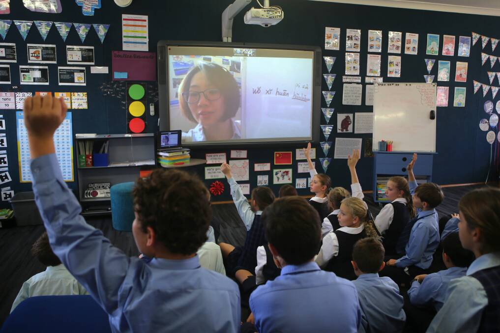 International voices: Year 4 pupils at St Aloysius Primary School during a live Mandarin lesson. Picture: John Veage