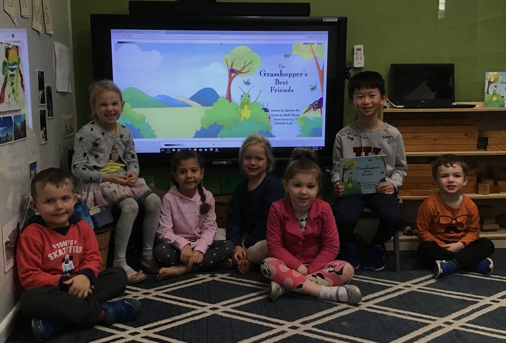 James Hu, pictured second from right, reads his book Rhys, Hartley, Aaliyah, Chloe, Kirsten and Leo at Bay Road Kindy.