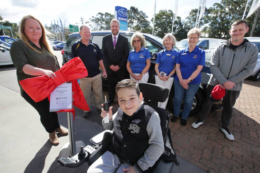 Generous gesture: Thomas, 9, with his mother Belinda, pictured far left, with Gary Richards (Rotary Engadine), Mark Vandy (Tynan Motors), Elizabeth Beves, Sue Maclean, Jenni Warren (Lioness Club of Sutherland Shire) and Matthew Wormleaton. Picture: John Veage