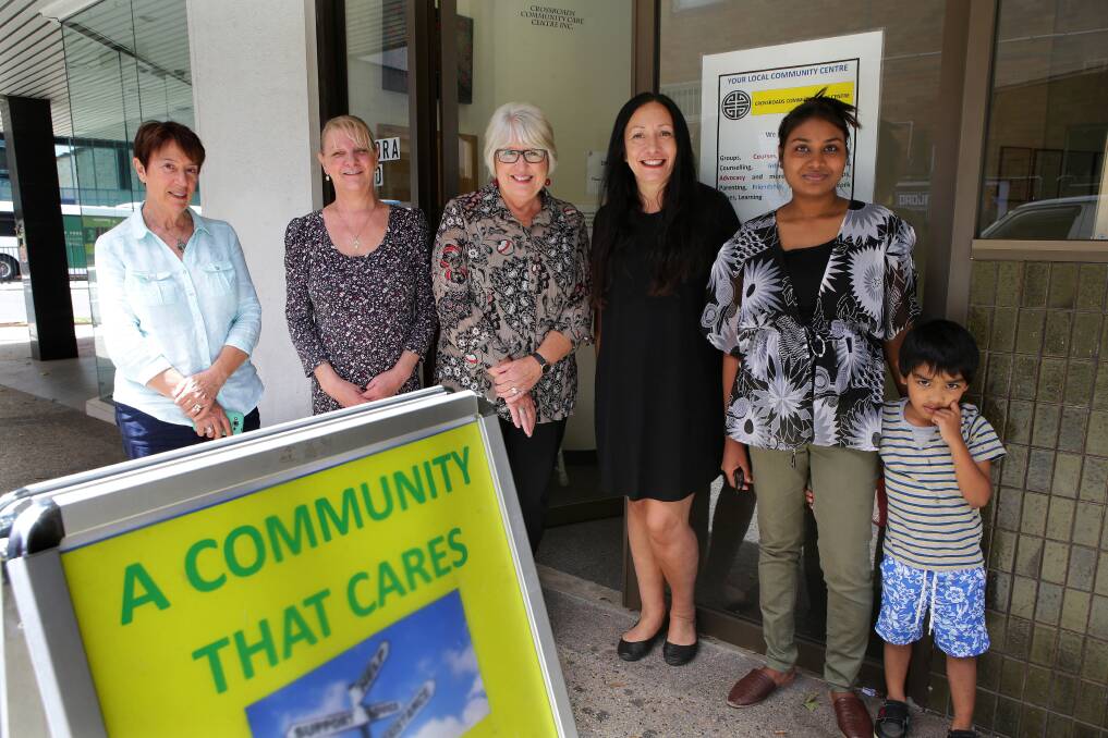 New space: Crossroads coordinator Christine Bird, domestic violence counsellor and family support worker Michele Taylor, volunteer Sue Jones, community support officer Lisa Lewis, and a mother from the service's refuge, Tani and her son Ian. Picture: John Veage