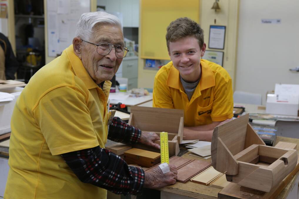 Generation woodwork: The Shire Woodworking Club's 80 members include the oldest, Doug Wickens, 97, and youngest, year 10 student of De La Salle College Caringbah, Spencer Ramsay, 15. Picture: John Veage
