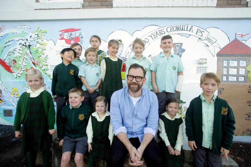 The Project comedian Lehmo chat to kids at Cronulla Public School during a break in filming. Picture: John Veage