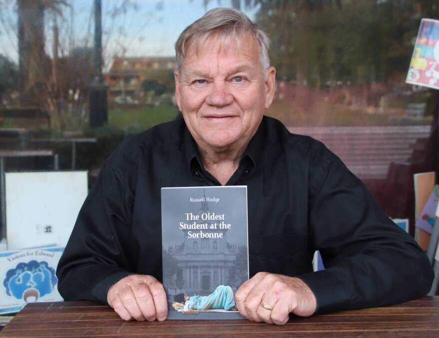 Recovery after despair: Russell Hodge with his new book, a memoir that details his experiences with homelessness.