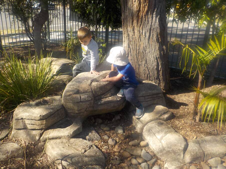 Nature's classroom: George and Samuel enjoy their new outdoor play area at a Heathcote preschool.