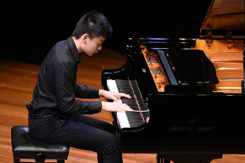 Focus: Joshua Zhi during his piano performance, for which he won first prize. Picture: Supplied/WinkiPoP Media 