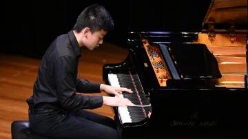 Focus: Joshua Zhi during his piano performance, for which he won first prize. Picture: Supplied/WinkiPoP Media 
