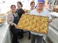 The team at Ibrahim Pastry Rockdale with a fresh batch of traditional Lebanese desserts. Picture by John Veage