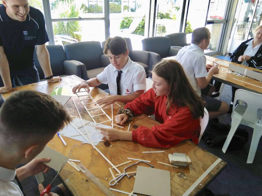Team time: Endeavour students work on some challenging tasks at a STEM day at ANSTO. 
