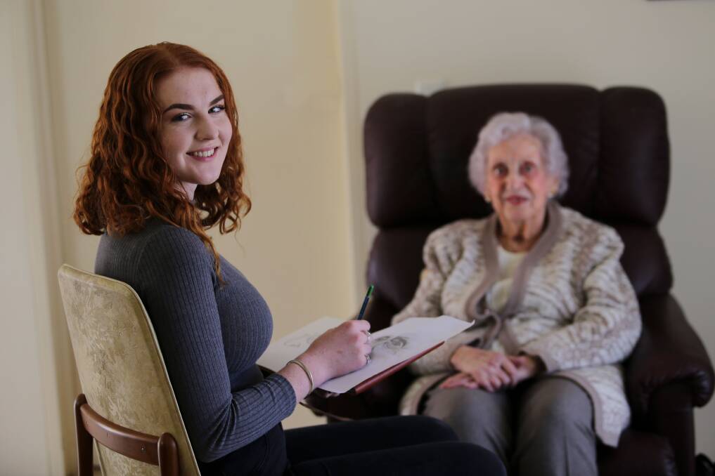 Kirrawee High School year 11 student Taya Corrigan sketches Heathcote's Jean Roberts, 100, for Sydney's first Centenarian Project. Picture: John Veage