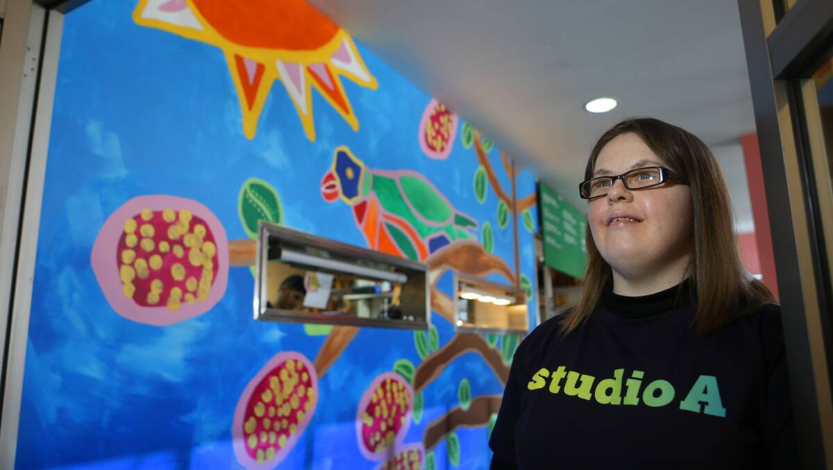 Large-scale work: Emily Crockford with her mural. Picture: John Veage 