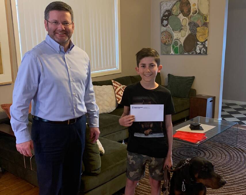 Helping hand: State MP for Oatley Mark Coure paid a visit to Vaughn and presented him with a cheque. Picture: Facebook/Mark Coure MP