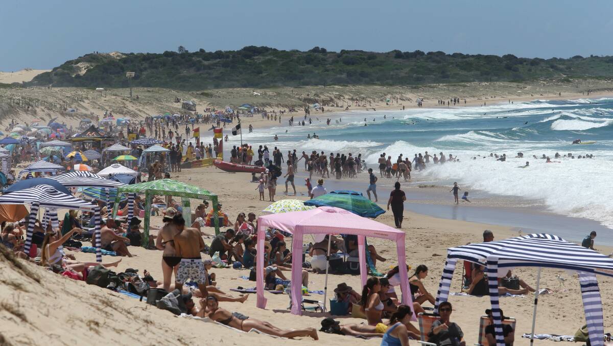 Keep your cool: Beachgoers flocked to Cronulla last Sunday causing large traffic queues. Pictures: John Veage 