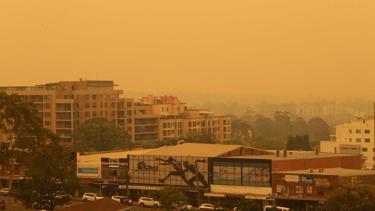 Orange hue: A thick smoky haze, seen here from Westfield Miranda's rooftop carpark, is choking St George and Sutherland Shire today. Picture: John Veage