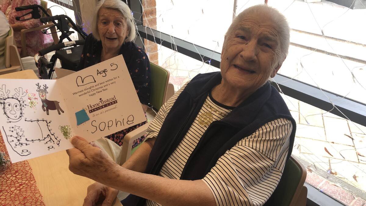 Santa's helpers: Children from Poppi's Preschool and Long Day Care at Miranda handed out Christmas cards to aged care residents of St Basil's Miranda.