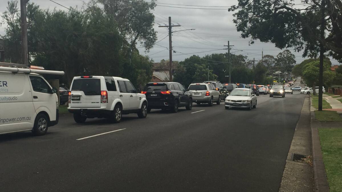 Car chaos: Traffic stretched about one kilometre down Port Hacking Road at Caringbah this afternoon.