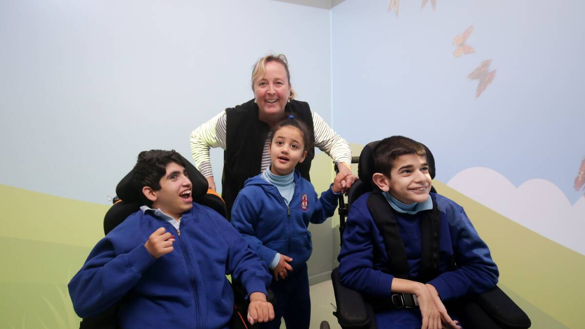 Interactive classroom: St George School deputy principal Annette Fuller with (L to R) Matthew Chiotis, Arianah Georges and Mouemin Hammoud. Pictures: Chris Lane