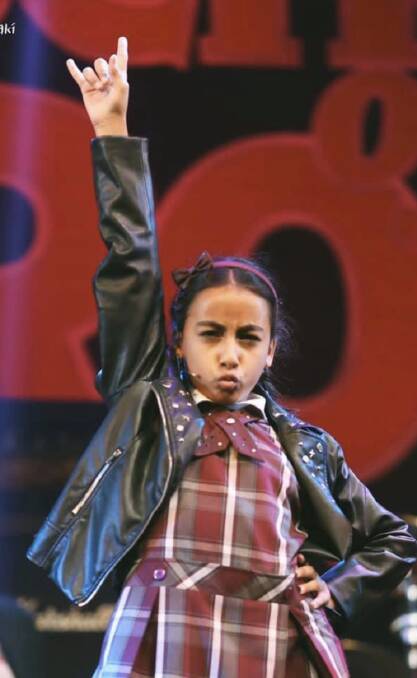 Ready to rock: Zoe Zantey, who shares the role of Sophie, on stage in School of Rock. Picture: Supplied
